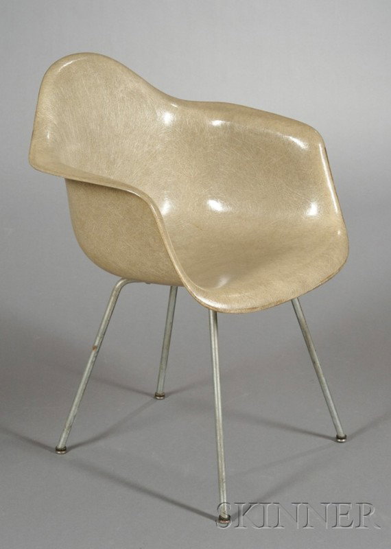 Charles Eames Shell Armchair Fiberglass and metal : Charles Eames Shell Armchair Fiberglass and metal Herman Miller, Zeeland, Michigan, c. 1960 Gray fiberglass shell raised on four metal rod feet, some wear and damage, paper label, ht. 31 1/4, wd. 24 3