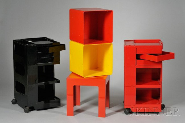 Two Joe Columbo Carts; Two Cubes and a Parsons Ta: Two Joe Columbo Carts; Two Cubes and a Parsons Table Injection molded plastic Italy Two carts, one in red, the other in black, with shelves and swing-out trays; accompanied by yellow and red stackable
