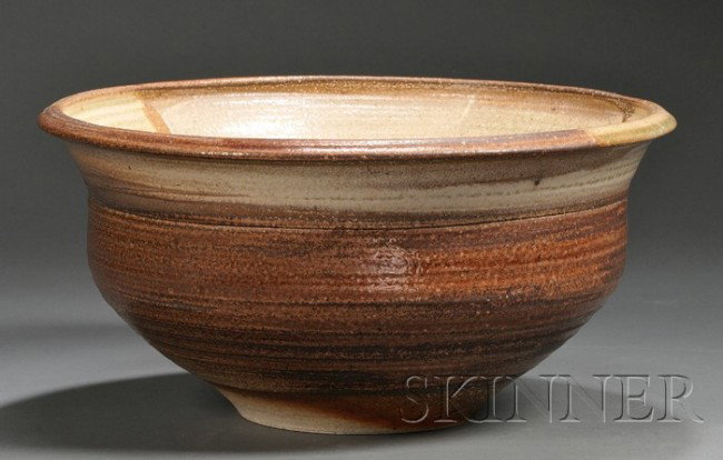 Karen Karnes (b. 1925) Pottery Salt glazed stonewa: Karen Karnes (b. 1925) Pottery Salt glazed stoneware Vermont, c. 1972 Large round bowl with everted rim, salt glazed in shades of tan and brown, impressed maker's mark on base edge, ht. 8, dia. 16 1/2