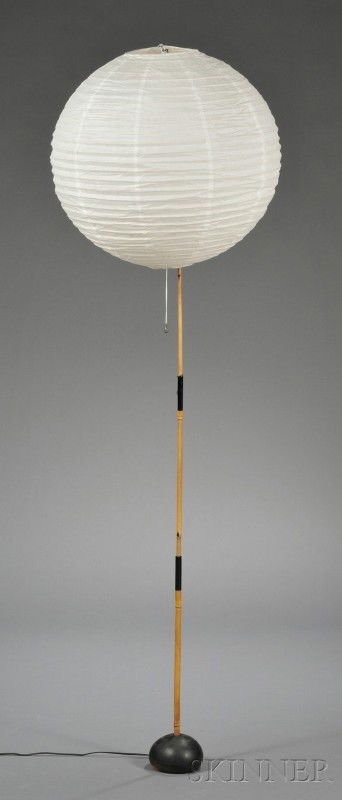 Isamu Noguchi Floor Lamp Paper, bamboo, and iron R: Isamu Noguchi Floor Lamp Paper, bamboo, and iron Retailed by Forthright George Kovacs, New York, mid -20th century Handmade paper globe, over a single socket on bamboo stem with a cast iron base in th