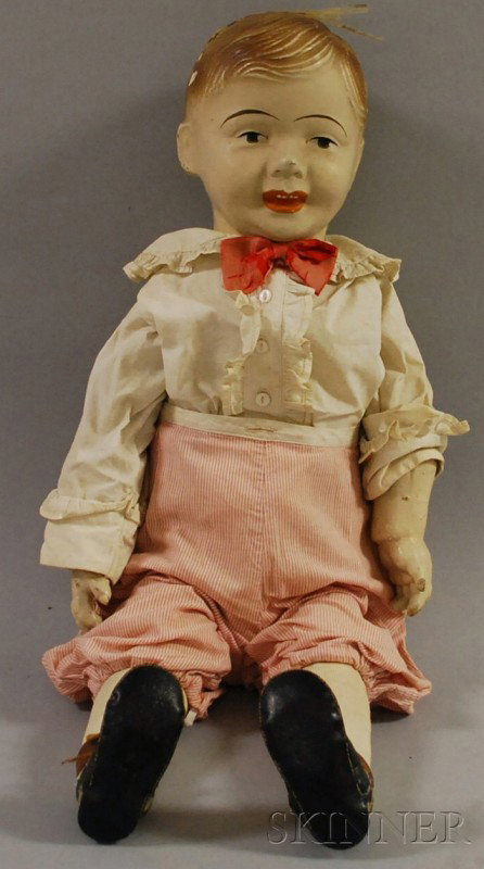 Large Composite Boy Doll, painted brown eyes, ope: Large Composite Boy Doll, painted brown eyes, open painted mouth, painted brown hair, cloth body and composite hands, old cotton shirt, bow tie and short striped pants, ht. 29 in. (damage to back of h