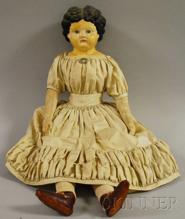 German Papier-mache Shoulder Doll, mid-19th centu: German Papier-mache Shoulder Doll, mid-19th century, painted blue eyes, closed mouth, cloth body, kid leather arms, silk plaid dress, red leather boots, beaded pin, ht. 26 in.