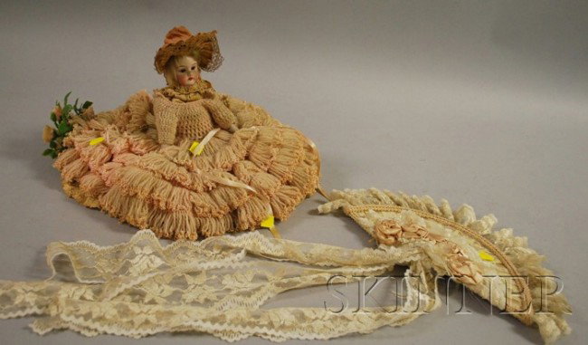 Small Bisque Shoulder Head Doll, sleep brown eye: Small Bisque Shoulder Head Doll, sleep brown eyes, some old clothes, with large decorative fan, ht. 12 in., (missing lower body and feet, damage).