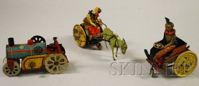 Three Lithographic Tin Vehicles, a D.R.G.M. donke: Three Lithographic Tin Vehicles, a D.R.G.M. donkey cart wind-up toy, a Orobr steam roller, and a D,R.G.M. circus three-wheel car.