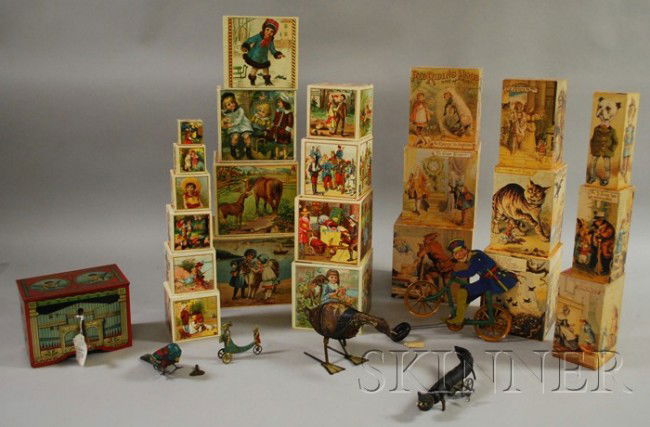 Group of Toys, a Marx lithographed tin goose, a t: Group of Toys, a Marx lithographed tin goose, a tin bird, two nested sets of ABC blocks, a A. C Gilbert tin bicycle, a scratch built wooden wind-up cat toy, and a German lithographed toy organ.