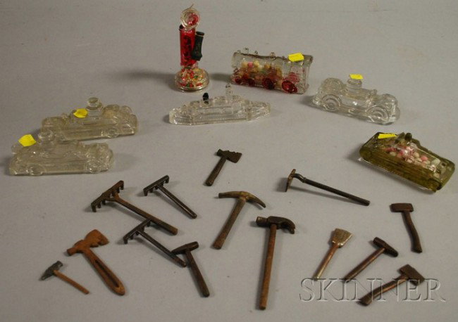 Group of Assorted Metal Toys and Glass Items, ha: Group of Assorted Metal Toys and Glass Items, hammer, three rakes, four axes, broom, and a group of Victory Glass Co. train, ship and phone.