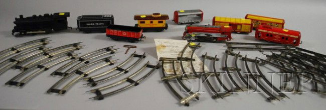 Two Partial Train Sets, Louis Marx & company win: Two Partial Train Sets, Louis Marx & company wind-up train and several cars, a Hafner wind-up train and four pressed-tin toy cars, some track.