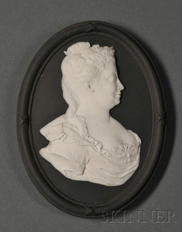 Wedgwood Bert Bentley Solid Black Jasper Portrait: Wedgwood Bert Bentley Solid Black Jasper Portrait Medallion, England, c. 1920, self-frame oval shape with applied white relief depiction of Queen Caroline, BB855, impressed mark, lg. 5 1/4 in.