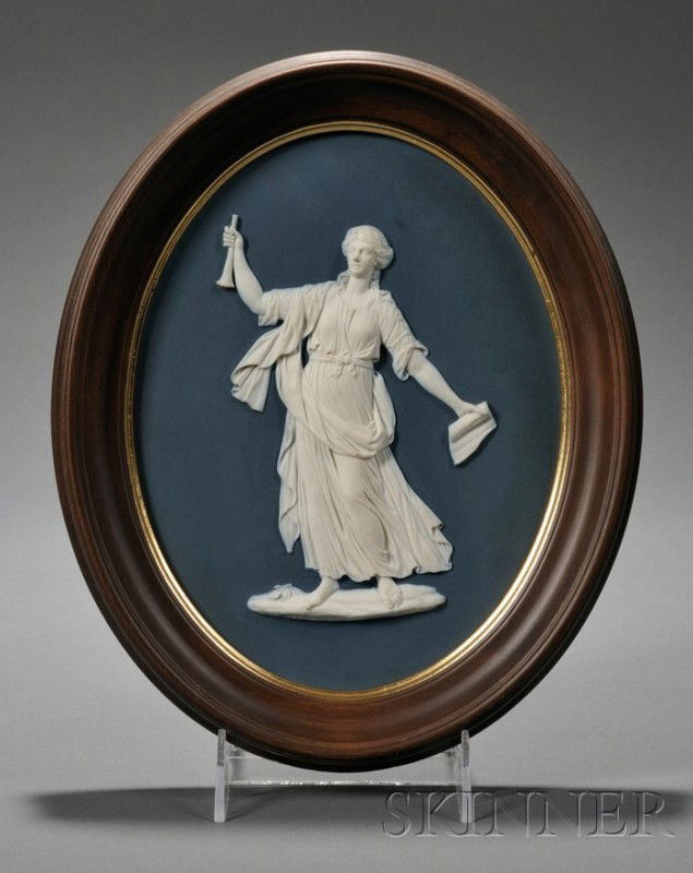 Wedgwood Bert Bentley Dark Blue Jasper Dip Plaque: Wedgwood Bert Bentley Dark Blue Jasper Dip Plaque Depicting Clio, England, c. 1925, BB1412, oval shape with applied white relief depiction of a classical maiden, impressed title and mark, lg. 9 in.; s