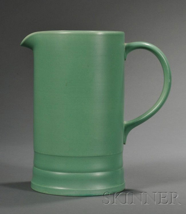 Wedgwood Keith Murray Matte Green Slip Glazed Beer: Wedgwood Keith Murray Matte Green Slip Glazed Beer Pitcher, England, c. 1935, cylindrical shape with double stepped foot, impressed and printed marks, ht. 9 5/8 in.