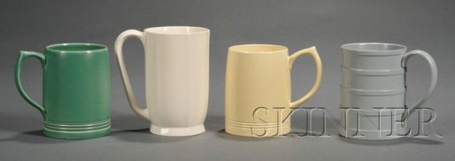 Four Wedgwood Keith Murray Design Mugs, England, c: Four Wedgwood Keith Murray Design Mugs, England, c. 1935, slip glazes in a matte cane, matte green, and grey; together with a queen's ware, impressed and printed marks, ht. 4 3/4 to 5 5/8 in.