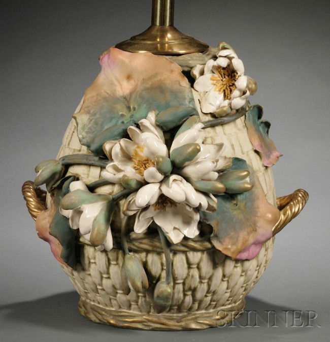 Large Amphora Pottery Lamp Base, Turn-Teplitz, lat: Large Amphora Pottery Lamp Base, Turn-Teplitz, late 19th/early 20th century, ovoid, molded as a basket and applied with large water lily flowers and leaves, with short gilt handles, drilled and electr