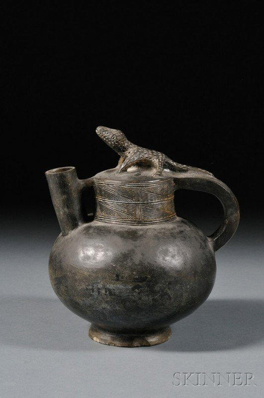 African Pottery Vessel, Lunda, Angola, with spout : African Pottery Vessel, Lunda, Angola, with spout and handle, with incised geometric decoration and lizard at the top, ht. 10 in.