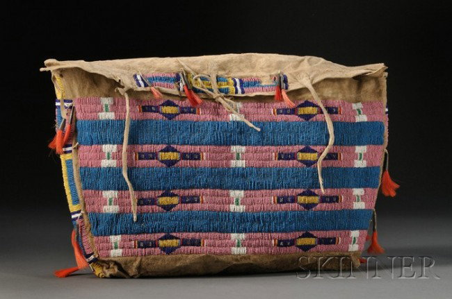 Central Plains Beaded Hide Possible Bag, c. 1900, : Central Plains Beaded Hide Possible Bag, c. 1900, buffalo hide, beaded on the flap, sides, and front with multicolored, geometric designs in a bar pattern, remnant tin cone danglers, (bead loss), 18 x