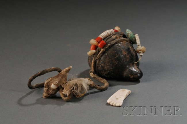 Southwest Carved Stone Turtle Fetish, Zuni, c. sec: Southwest Carved Stone Turtle Fetish, Zuni, c. second half 19th century, black granite wrapped with shell, coral, and turquoise beads on a leather thong, with small shell attachments, lg. 2 in. Proven