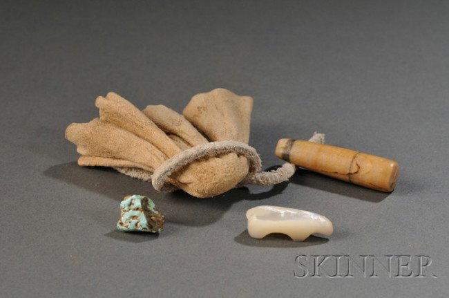 Southwest Carved Shell Bear Fetish, Navajo, c. 190: Southwest Carved Shell Bear Fetish, Navajo, c. 1900, included is a "Pahoe" stone and a turquoise nugget, with small hide pouch, bear lg. 7/8 in. Provenance: Ex-collection Skip Holbrook.