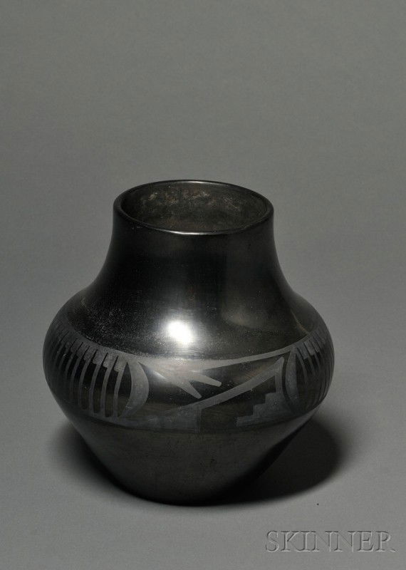 Southwest Polished Black Pottery Vessel, San Ildef: Southwest Polished Black Pottery Vessel, San Ildefonso, Maria and Julian, has a long neck and a variant feather design at the median, (surface damage), ht. 8 1/2, dia. 7 3/4 in.