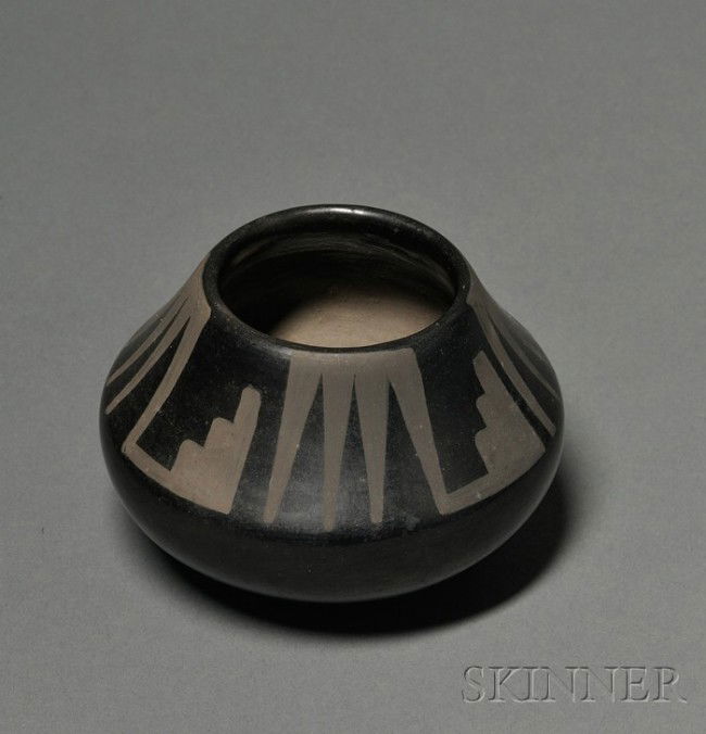 Southwest Black on Black Pottery Bowl, San Ildefon: Southwest Black on Black Pottery Bowl, San Ildefonso, Maria and Santana, with geometric designs on the neck, (some surface spotting), ht. 3 1/4, dia. 4 1/4 in.