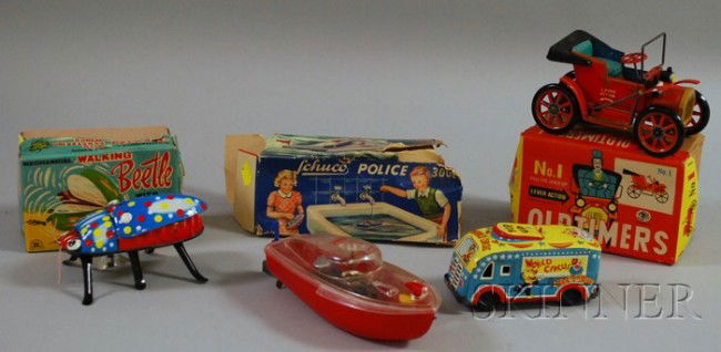 Four Tin and Plastic Toy Vehicles, mid-20th century: Four Tin and Plastic Toy Vehicles, mid-20th century, a Schuco wind-up plastic police boat with original box, a Japanese mechanical walking beetle with original box, a Japanese "Oldtimers" no. 1 lever