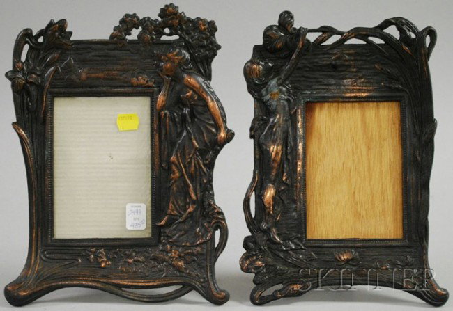 Two Art Nouveau-style Cast Metal Figural Picture F: Two Art Nouveau-style Cast Metal Figural Picture Frames, each depicting a girl amidst flowers.
