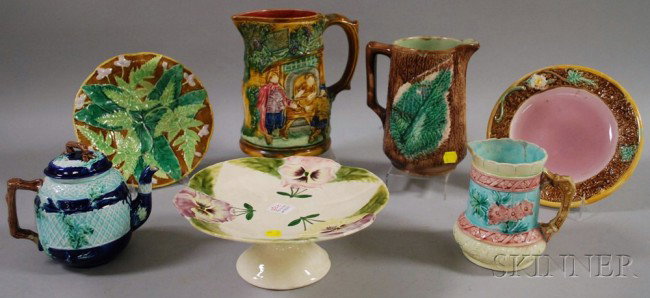 Seven Pieces of Assorted Majolica Tableware, a jug: Seven Pieces of Assorted Majolica Tableware, a jug, teapot, tazza, two plates, and two pitchers.