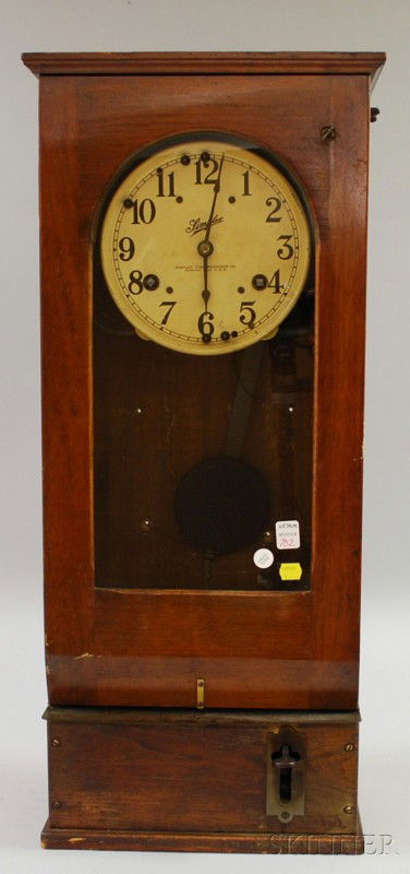 Walnut Time Clock by Simplex Time Recording Compan: Walnut Time Clock by Simplex Time Recording Company, Gardner, Massachusetts, the painted zinc dial with Arabic numerals and signed by maker, time stamp mechanism in the lower section, dual-spring, tim