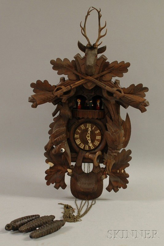 Walnut Black Forest Cuckoo Clock, a Le Coultre Bra: Walnut Black Forest Cuckoo Clock, a Le Coultre Brass Atmos Clock, and a German Clock with Glass Dome, the cuckoo with three-train weight-powered movement with cuckoo and musical box selection on the h