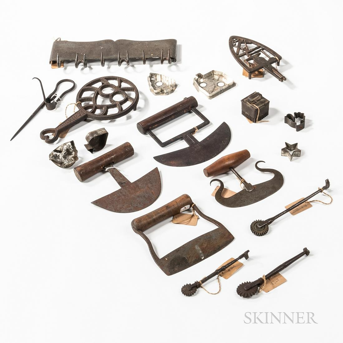 Group of Iron, Tin, and Wood Kitchen Items, 19th: Group of Iron, Tin, and Wood Kitchen Items, 19th century, including choppers, cookie cutters, jagging wheels, a sticking tommy, a biscuit cutter, two trivets, and a small meat rack.