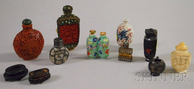 Nine Asian Snuff Bottles, one carved cinnabar depi: Nine Asian Snuff Bottles, one carved cinnabar depicting an elephant, ht. 3; a metal cased cinnabar with green inset stones, ht. 3 1/4; a carved bone with three figures, ht. 2 1/4 in.; two porcelain, e