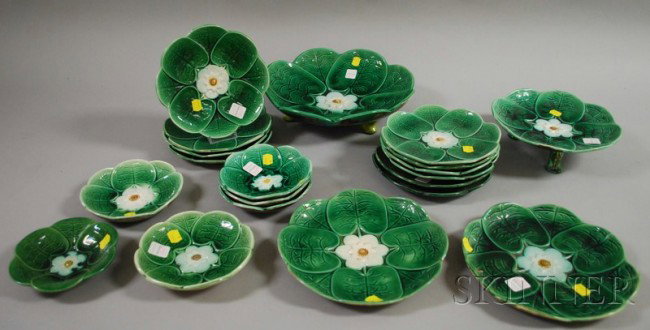 Twenty Pieces of Majolica Water Lily Pattern Table: Twenty Pieces of Majolica Water Lily Pattern Tableware, including six small plates and bowls, twelve plates, a footed bowl, and a footed pastry dish.