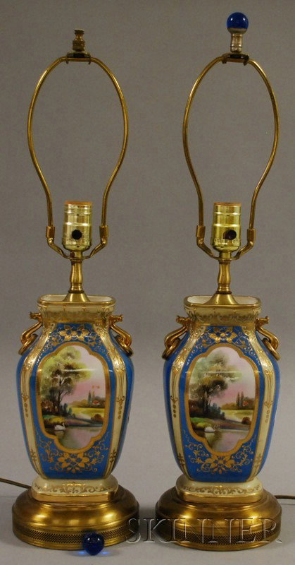 Pair of Gilt and Hand-painted Landscape-decorated : Pair of Gilt and Hand-painted Landscape-decorated Porcelain Vase/Table Lamps, attributed to Nippon, with gilt-metal mounts.