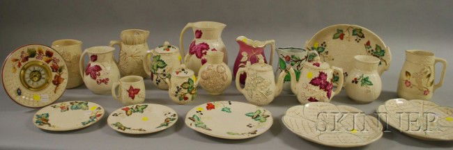 Twenty-one Pieces of Avalon Faienceware, including: Twenty-one Pieces of Avalon Faienceware, including a clock, plates, platters, teapots, seven jugs, etc.