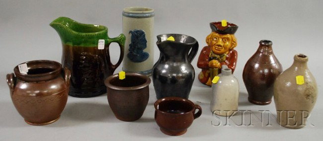 Eight Pieces of Assorted Glazed Stoneware, Redwar: Eight Pieces of Assorted Glazed Stoneware, Redware, and a Majolica Glazed Redware Toby Jug and Pottery Pitcher, including jugs, jars, a vase, and a cup.