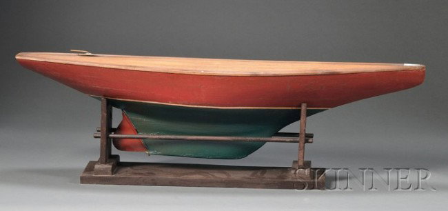 Red- and Green-painted Wood Pond Boat Model, Ameri: Red- and Green-painted Wood Pond Boat Model, America, early 20th century, on a wooden stand, overall ht. 10, wd. 8 1/4, lg. 33 1/4 in.