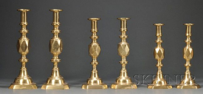 Three Pairs of Diamond Jubilee Commemorative Brass: Three Pairs of Diamond Jubilee Commemorative Brass Candlesticks, James Clews and Sons of Manilla Works, Birmingham, England, c. 1897, the push-up candlesticks with diamond-faceted knop and cut-corner