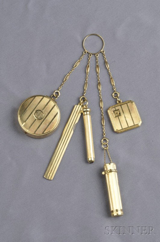 14kt Gold Chatelaine, composed of fancy-link chain: 14kt Gold Chatelaine, composed of fancy-link chain suspending a pillbox, pencil, knife, lipstick, and locket, with engraved line detail, 55.8 dwt, lg. 7 in.