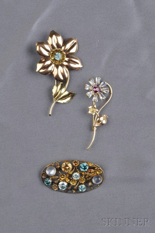 Three 14kt Gold Gem-set Brooches, two flower brooc: Three 14kt Gold Gem-set Brooches, two flower brooches, one with a blue zircon, the other with aquamarine and rhodalite garnet, the third oval brooch with blue and brown zircons and cabochon moonstones