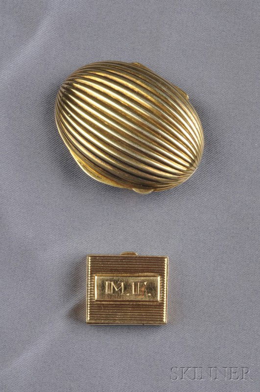 Silver-gilt Pillbox, Tiffany & Co. and a 14kt Gold: Silver-gilt Pillbox, Tiffany & Co. and a 14kt Gold Pillbox, an egg-shaped box of ribbed design, signed, and a 14kt gold rectangular-shaped box, 7.4 dwt, unsigned, lg. 2 and 7/8 in.