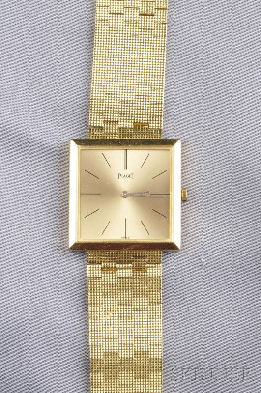 18kt Gold Wristwatch, Piaget, the gold-tone metal: 18kt Gold Wristwatch, Piaget, the gold-tone metal dial with baton numeral indicators, enclosing a manual-wind 18-jewel movement no. 590162, case no. 901 190064, completed by a textured brickwork link