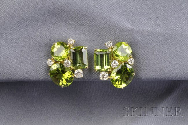 18kt Gold, Peridot, and Diamond Earclips, Donna Vo: 18kt Gold, Peridot, and Diamond Earclips, Donna Vock, each prong-set with three fancy-shaped peridot, and full-cut diamond highlights, lg. 7/8 in., signed.