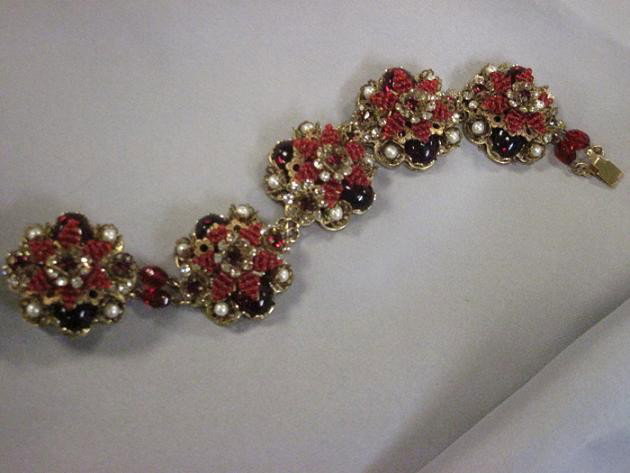 Gilded Metal and Colored Glass Bead Bracelet, Stan: Gilded Metal and Colored Glass Bead Bracelet, Stanley Hagler, designed as floral clusters set with red glass and simulated pearls, gilded metal backings, lg. 7 1/2 in.