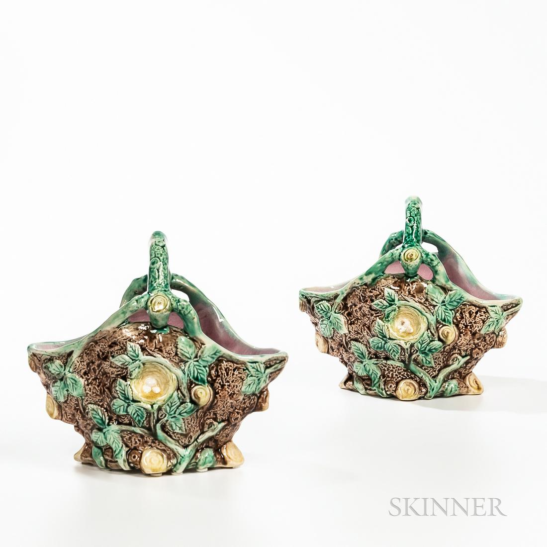 Pair of Majolica Baskets, England, c. 1880, each modeled with branch-like bail handles, tree trunk: Pair of Majolica Baskets, England, c. 1880, each modeled with branch-like bail handles, tree trunk bodies with foliage and a bird's nest to either side, ht. 8 in.