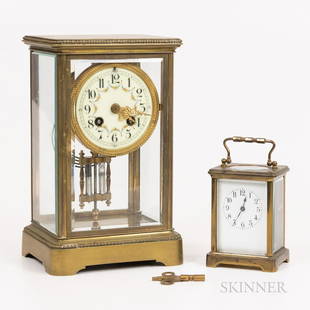 Two French Brass and Glass Clocks, one with 3 1/2-in enameled arabic numeral dial and floral: Two French Brass and Glass Clocks, one with 3 1/2-in enameled arabic numeral dial and floral decoration, marked Japy Freres, ht. 10 1/8, one carriage clock with enamel Arabic numeral dial, ht. 5 5/8