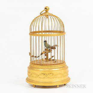 Reuge Singing Bird in Cage Automaton/Music Box, Switzerland, 20th century, marked on base Reuge: Reuge Singing Bird in Cage Automaton/Music Box, Switzerland, 20th century, marked on base Reuge Music Saint-Croix Made in Switzerland, ht. 11 1/2 in.