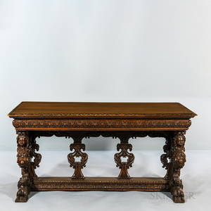 Renaissance Revival Heavily-carved Walnut Library Table, with carved and pierced supports, ornately