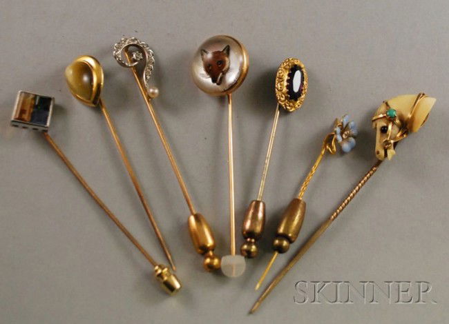 Seven Stickpins, including a gold, diamond, and pe: Seven Stickpins, including a gold, diamond, and pearl question mark pin, an enamel and diamond pansy pin, a reverse-painted intaglio glass pin of a fox, an ivory horse head pin, and several gem-set pi