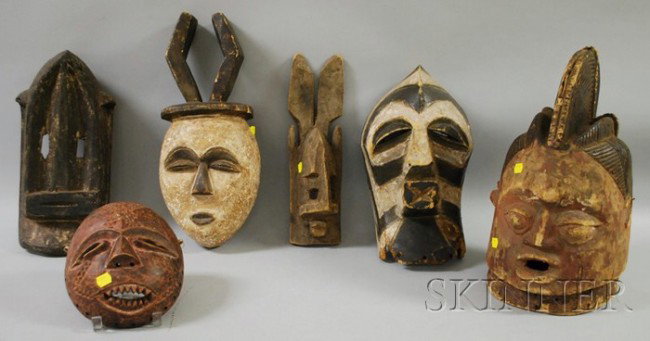 Six African Carved Wooden Masks, including a Yorub: Six African Carved Wooden Masks, including a Yoruba helmet mask, ht. to 15 in.