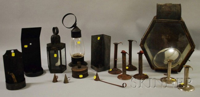 Thirteen Assorted Tin and Metal Lighting Devices,: Thirteen Assorted Tin and Metal Lighting Devices, a large paneled tin and glass lantern with mercury glass reflector, two glass and tin lanterns, six hogscraper candlesticks, three tin sconces, and a 