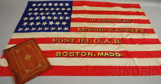Leather Cased Printed and Painted Silk G.A.R. Mem: Leather Cased Printed and Painted Silk G.A.R. Memorial American Flag, with forty-five stars, inscribed "In Memoriam Edward W. Kinsley, Post 113 G.A.R., Boston," (folded, small tear).