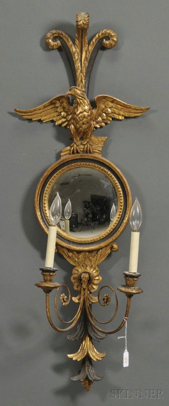 Regency Style Mirrored Two-light Sconce, 19th/20th: Regency Style Mirrored Two-light Sconce, 19th/20th century, giltwood and black painted with fleur-de-lis above an eagle perched atop a circular convex mirror with foliate stem, lg. 39 in.